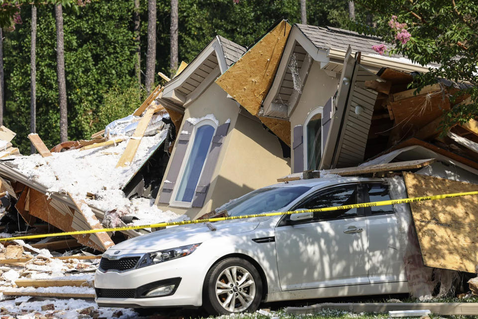 A vehicle is seen under rubble of a home on Lake Norman that collapsed in Mooresville, N.C., on Tuesday, Aug. 22, 2023. (Melissa Melvin-Rodriguez/The Charlotte Observer via AP)