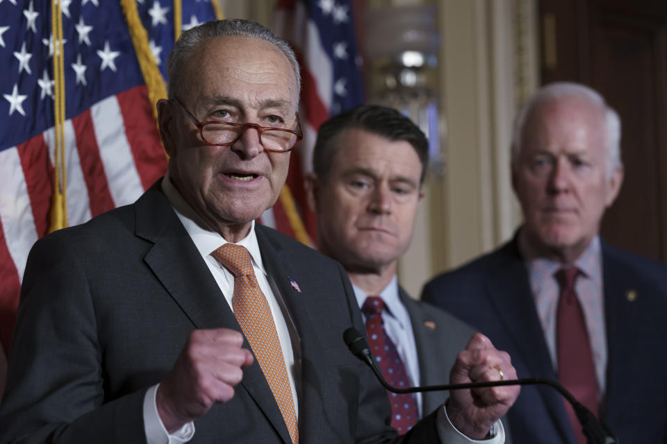 From left, Senate Majority Leader Chuck Schumer, D-N.Y., Sen. Todd Young, R-Ind., and Sen. John Cornyn, R-Texas, talk about the bipartisan effort to pass a bill designed to encourage more semiconductor companies to build chip plants in the United States, at the Capitol in Washington, Wednesday, July 27, 2022. The $280 billion measure, which awaits a House vote, includes federal grants and tax breaks for companies that construct their chip facilities in the U.S. (AP Photo/J. Scott Applewhite)