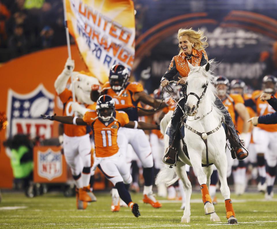 Wegener rides the Broncos mascot, Thunder, onto the field before the start of the NFL Super Bowl XLVIII football game against the Seahawks in East Rutherford