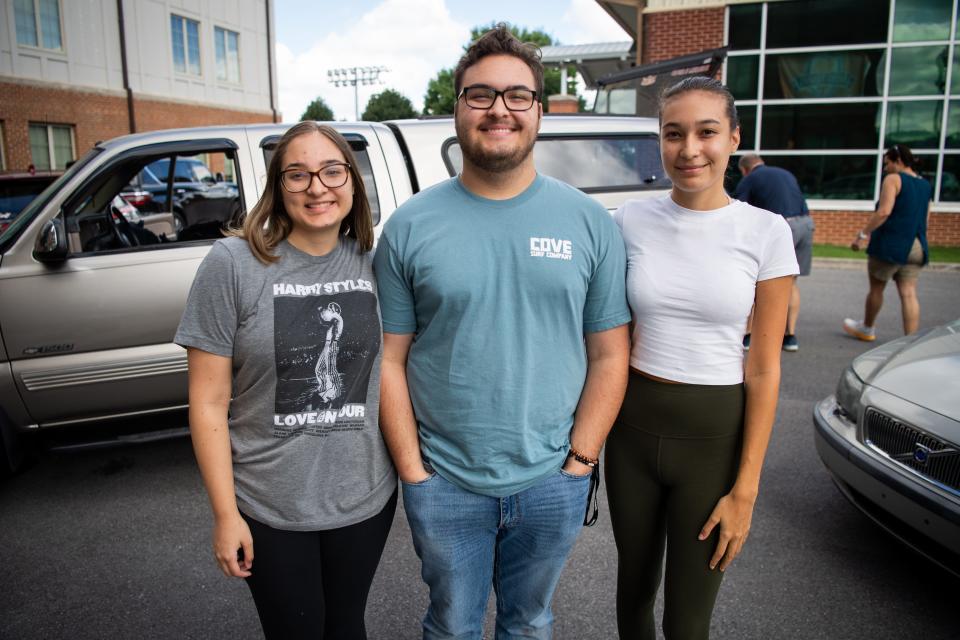 University of Tennessee freshmen and triplets, from left, Marissa Scott, David Scott and Anna Scott are photographed during move-in day on Wednesday, August 16, 2023.