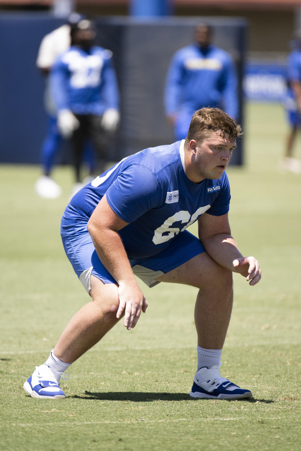 Los Angeles Rams guard Logan Bruss works on a drill during NFL football practice Tuesday, July 26, 2022, in Irvine, Calif. (AP Photo/Kyusung Gong)