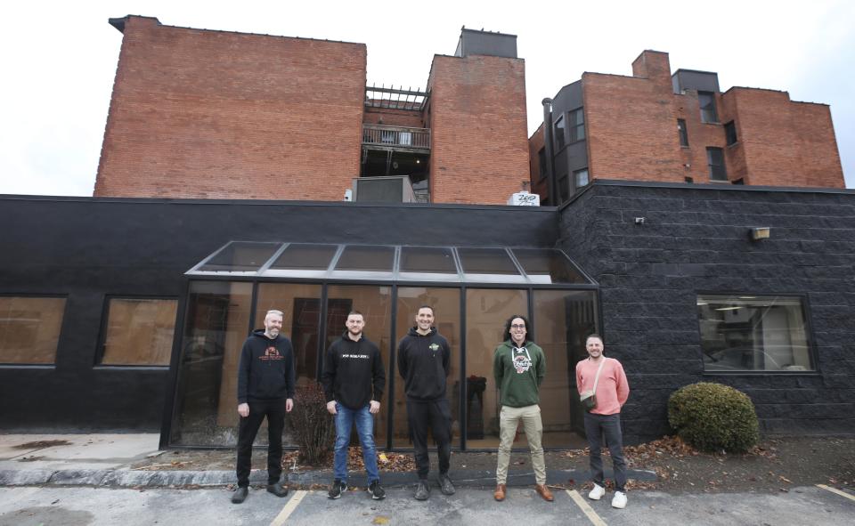 The faces behind the new restaurant Vinalia Urbana going into the former Dac Hoa space at 230 Monroe Avenue in downtown Rochester Tuesday, Dec. 5, 2023. Pictured from left are Brian Arliss, Adam Kirkpatrick, Tom Joy, Joey Joy and JJ Cutaia.