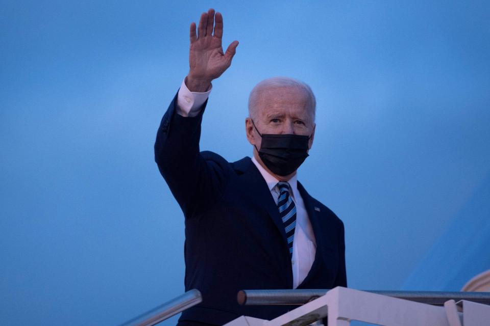 President Joe Biden waves as he boards Air Force One prior to his departure from Royal Air Force Mildenhall, England on Wednesday.