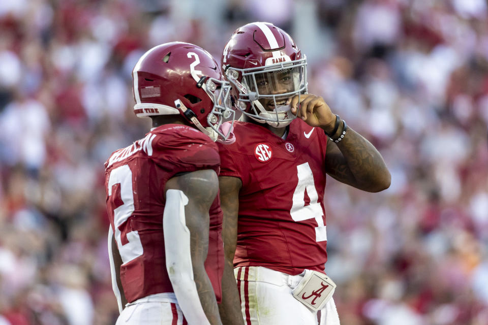 Alabama quarterback Jalen Milroe (4) talks with running back Jase McClellan (2) during a break in the second half of an NCAA college football game against Tennessee, Saturday, Oct. 21, 2023, in Tuscaloosa, Ala. (AP Photo/Vasha Hunt)