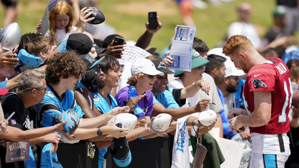 Carolina Panthers quarterback Andy Dalton signs autographs after a joint NFL football camp with the Carolina Panthers and the New York Jets, Wednesday, Aug. 9, 2023, in Spartanburg, S.C. (AP Photo/Mike Stewart)