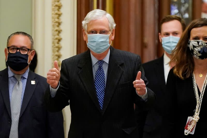 Senate Majority Leader McConnell gives a thumbs up after the confirmation vote of Amy Coney Barrett to the Supreme Court in Washington