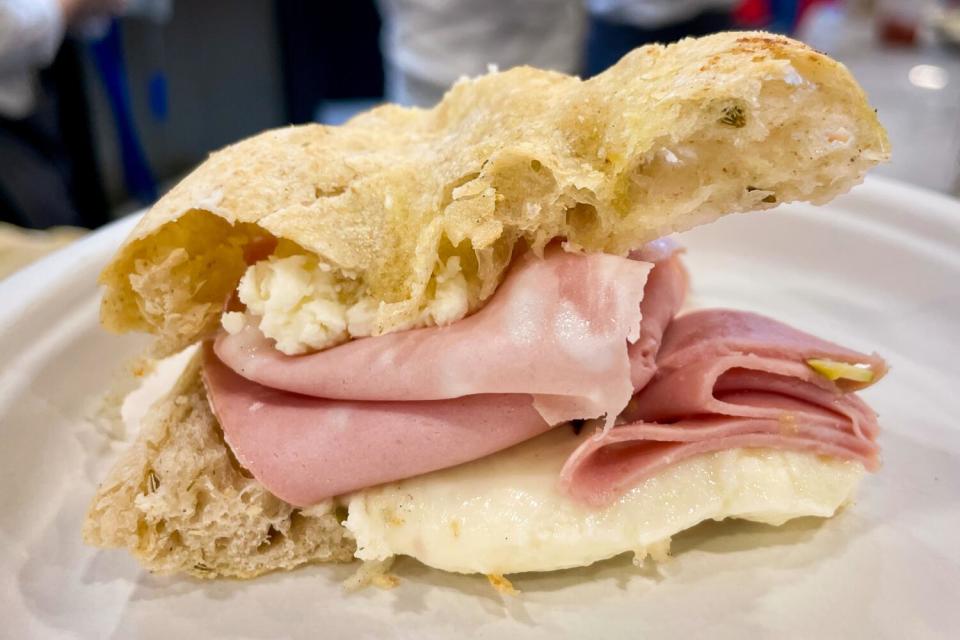 Spianata focaccia split and stuffed with mortadella and stracchino