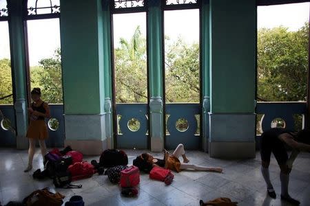 Students at the Cuba's National Ballet School (ENB) relax during a break in Havana, Cuba, October 12, 2016. Picture taken October 12, 2016. REUTERS/Alexandre Meneghini