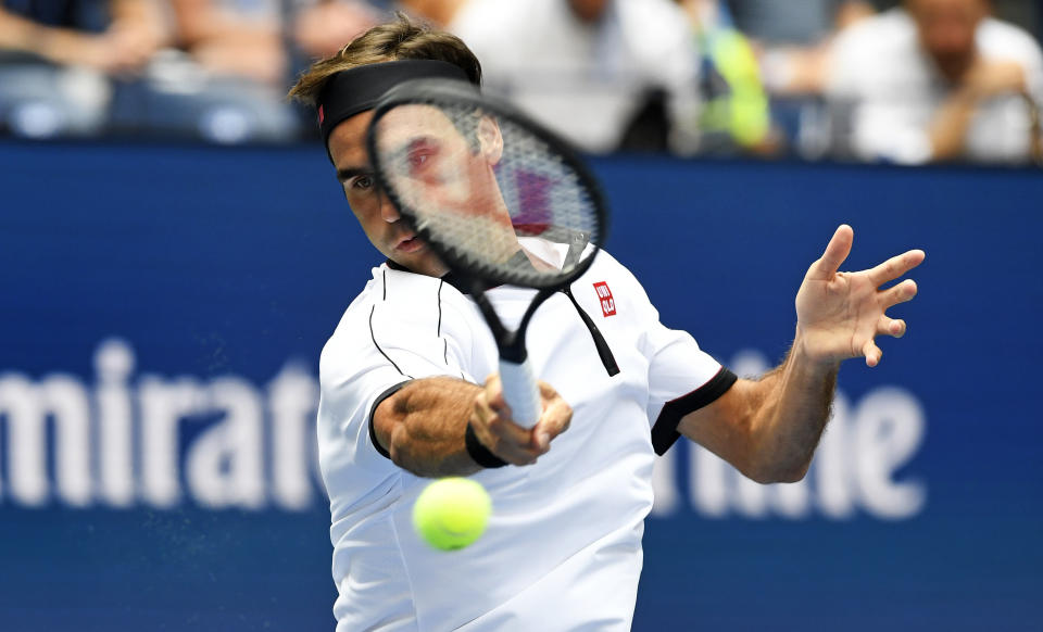 Roger Federer, of Switzerland, returns to David Goffin, of Belgium, during the fourth round of the US Open tennis championships Sunday, Sept. 1, 2019, in New York. (AP Photo/Sarah Stier)