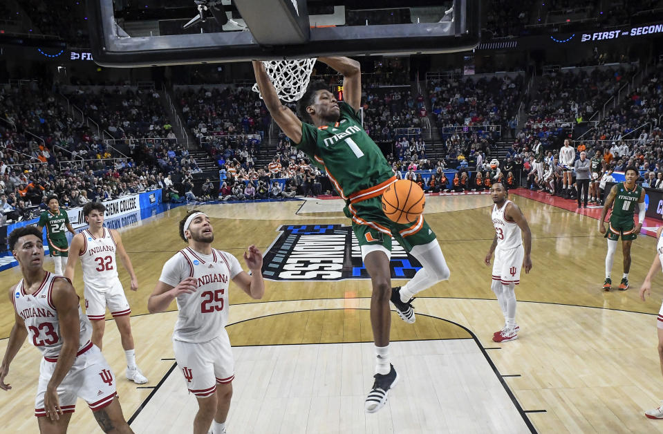 Miami forward Anthony Walker (1) dunks against Indiana during the first half of a second-round college basketball game in the men's NCAA Tournament on Sunday, March 19, 2023, in Albany, N.Y. (AP Photo/Hans Pennink)