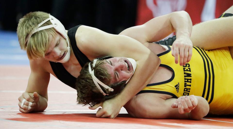 Plymouth’s Silas Dailey, left, wrestles Northwestern’s Tanner Kaufman in a Div. 2, 170-pound match during the WIAA Individual State Wrestling at the Kohl Center, Saturday, February 25, 2023, in Madison, Wis.