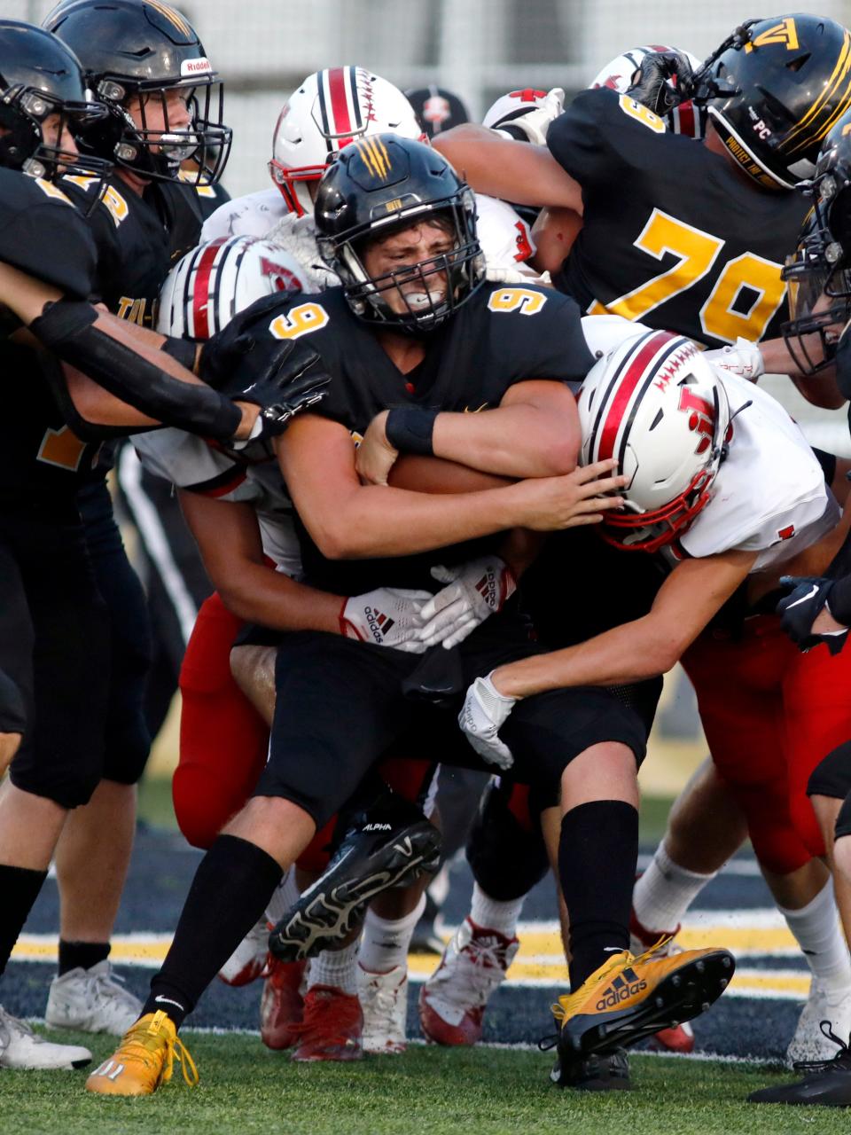 Tri-Valley's Max Lyall is stacked up on the goal line by the Jackson defense during the first half of their game on Friday night at Jack Anderson Stadium. Tri-Valley won, 14-13, as Lyall passed for 279 yards and 2 TDs.