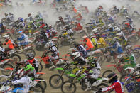 Bikers start on sandy beach as they take part in the "Enduropale" motorcycle endurance race on the beach of Le Touquet, northern France, February 3, 2013. About 1,000 motorbikes and 500 quad bike riders descend on Le Touquet every year for the event. REUTERS/Pascal Rossignol (FRANCE - Tags: SPORT MOTOR RACING) - RTR3DANR