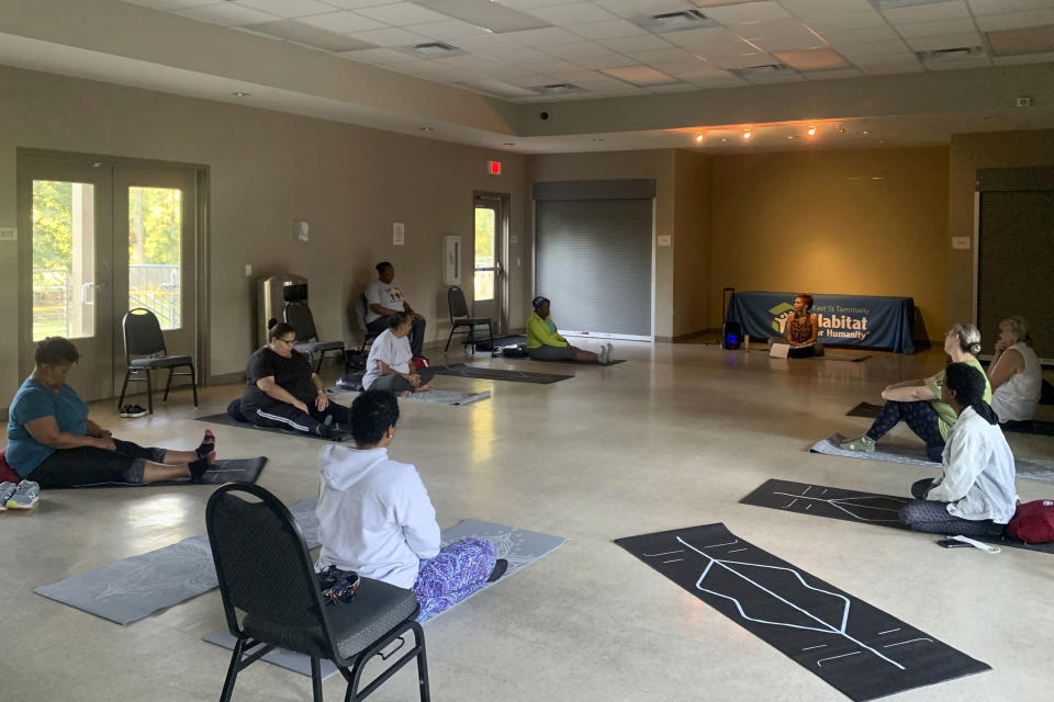 Participants in a six-week mindfulness course put on by East St. Tammany Habitat for Humanity and the Northshore Community Foundation gather in Slidell, La. (Kentrell Jones via AP)