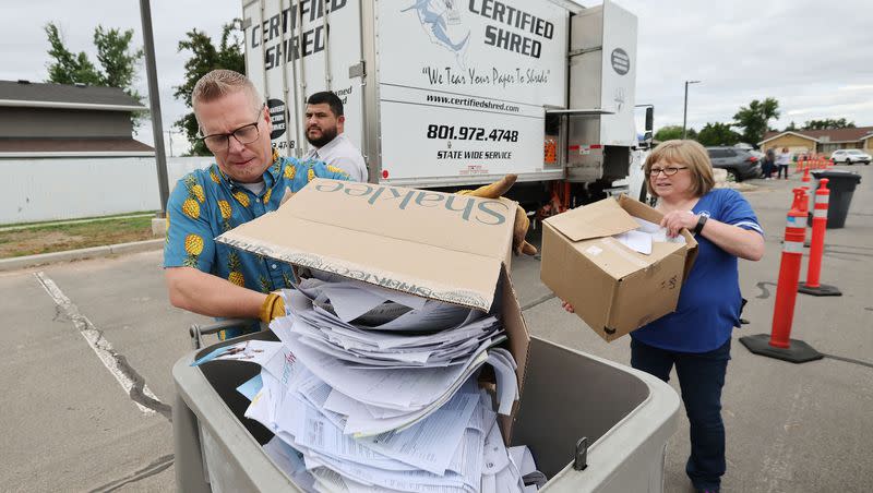 Brady Lane and Shantel Clark, Weber Human Services workers, shred documents at the Roy Hillside Senior Center in Roy on Friday, June 2, 2023.