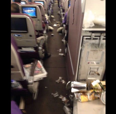 Belongings appear to have scattered down the aisle. Source: Twitter/ @LazyAviator