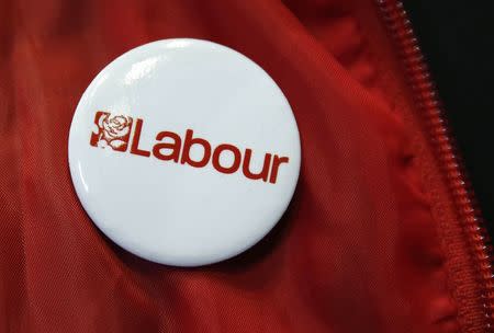 A Labour party badge is displayed at a trade stand during the Labour party's annual conference in Manchester, northern England September 23, 2014. REUTERS/Suzanne Plunkett