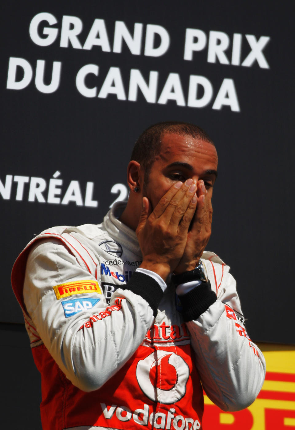 MONTREAL, CANADA - JUNE 10: Lewis Hamilton of Great Britain and McLaren celebrates on the podium after winning the Canadian Formula One Grand Prix at the Circuit Gilles Villeneuve on June 10, 2012 in Montreal, Canada. (Photo by Paul Gilham/Getty Images)