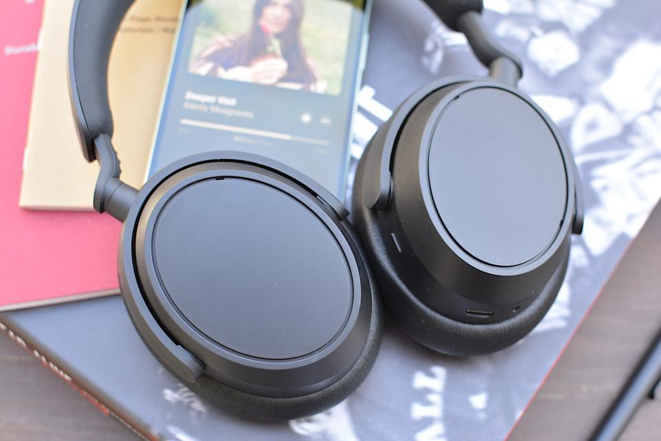 <p>Sennheiser Accentum Plus headphones laid flat from the top on top of two books, two Field Notes notebooks and an iPhone playing Kacey Musgraves.</p>
