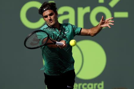 Mar 30, 2017; Miami, FL, USA; Roger Federer of Switzerland hits a forehand against Tomas Berdych of the Czech Republic (not pictured) in a men's singles quarter-final during the 2017 Miami Open at Crandon Park Tennis Center. Federer won 6-2, 3-6, 7-6(6). Geoff Burke-USA TODAY Sports