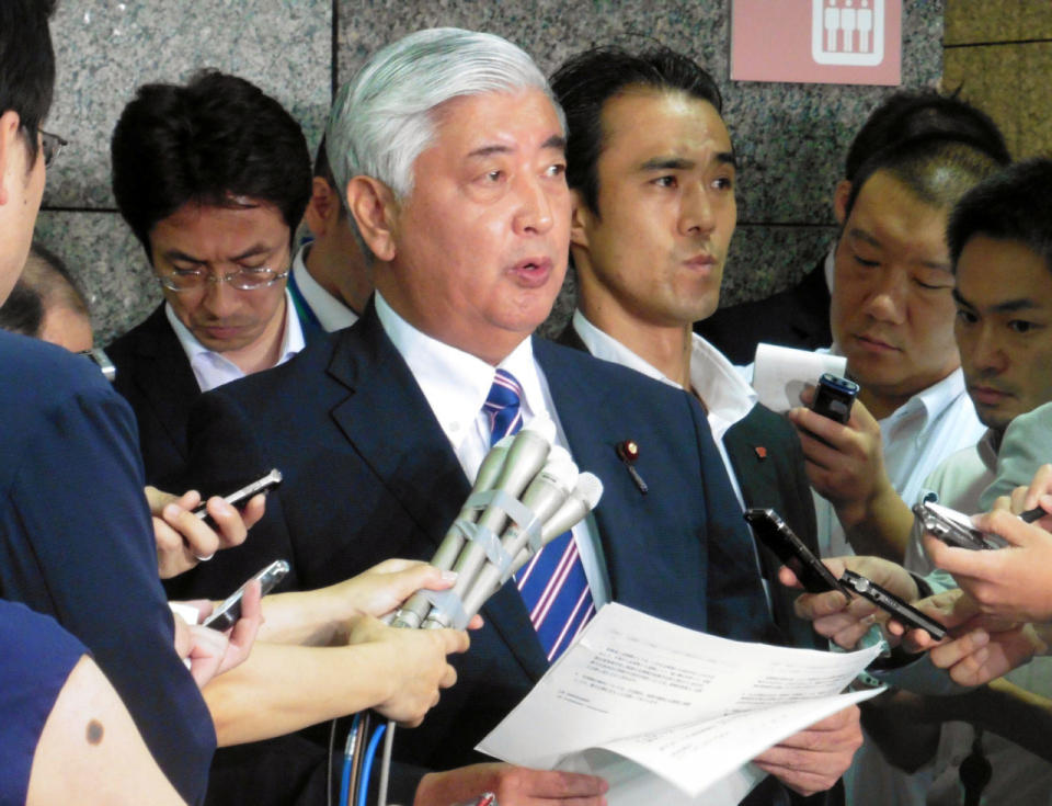 Japan's Defense Minister Gen Nakatani (C) speaks to the media regarding North Korea's missile launch, in Tokyo, Japan, in this photo taken by Kyodo August 3, 2016. (Kyodo/via REUTERS)