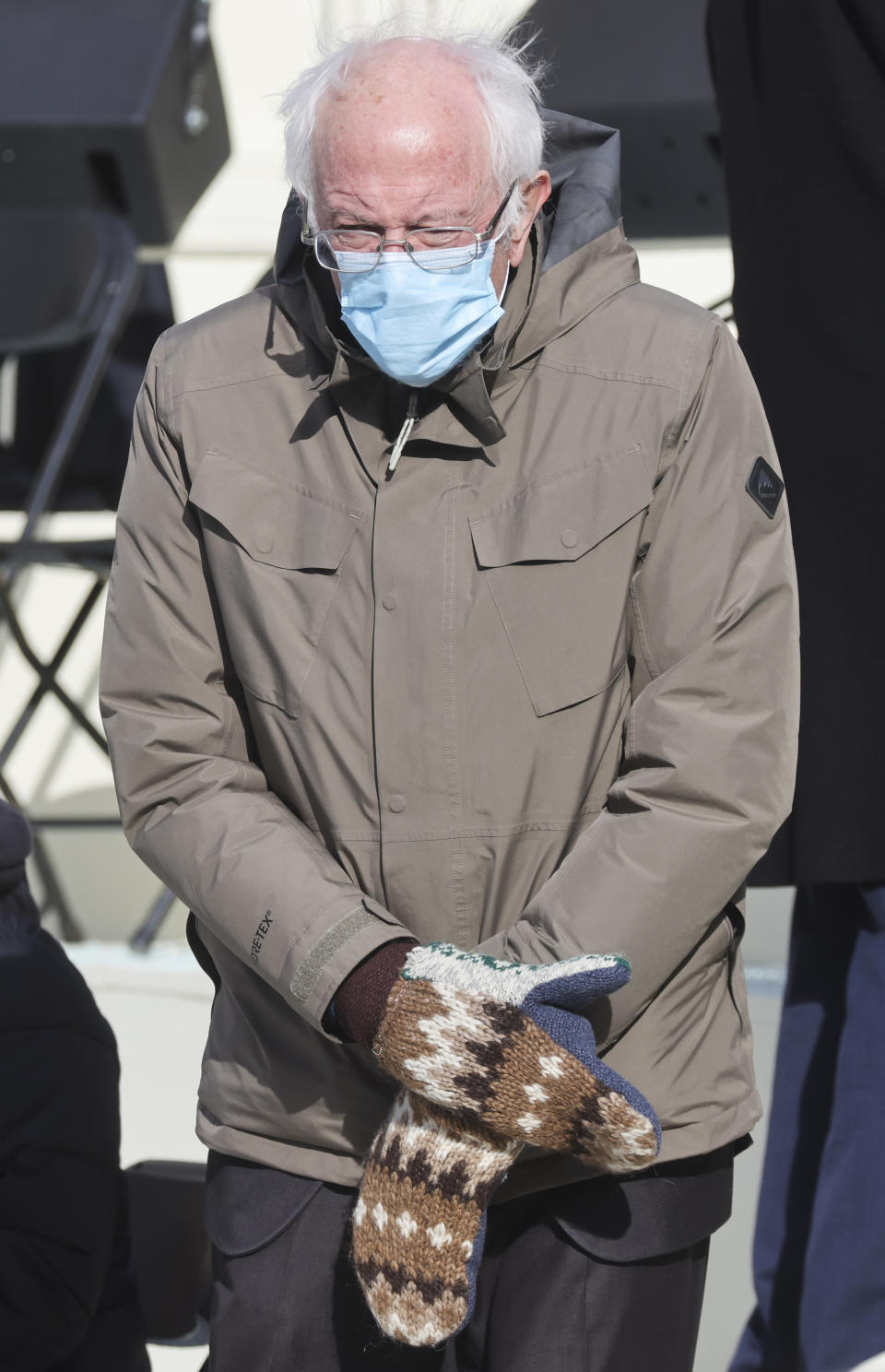 FILE - In this Jan. 20, 2021 file photo, Sen. Bernie Sanders, I-Vt., wears mittens as he attends President Joe Biden's inauguration ceremony at the U.S. Capitol in Washington. Sanders says the wooly mittens he wore to the ceremony that sparked endless quirky memes across social media have helped to raise $1.8 million in the last five days for charitable organizations in his home state of Vermont through the sale of T-shirts, sweatshirts and stickers with the iconic image of him sitting with his arms and legs crossed in his brown parka and recycled wool mittens (Jonathan Ernst/Pool Photo via AP)