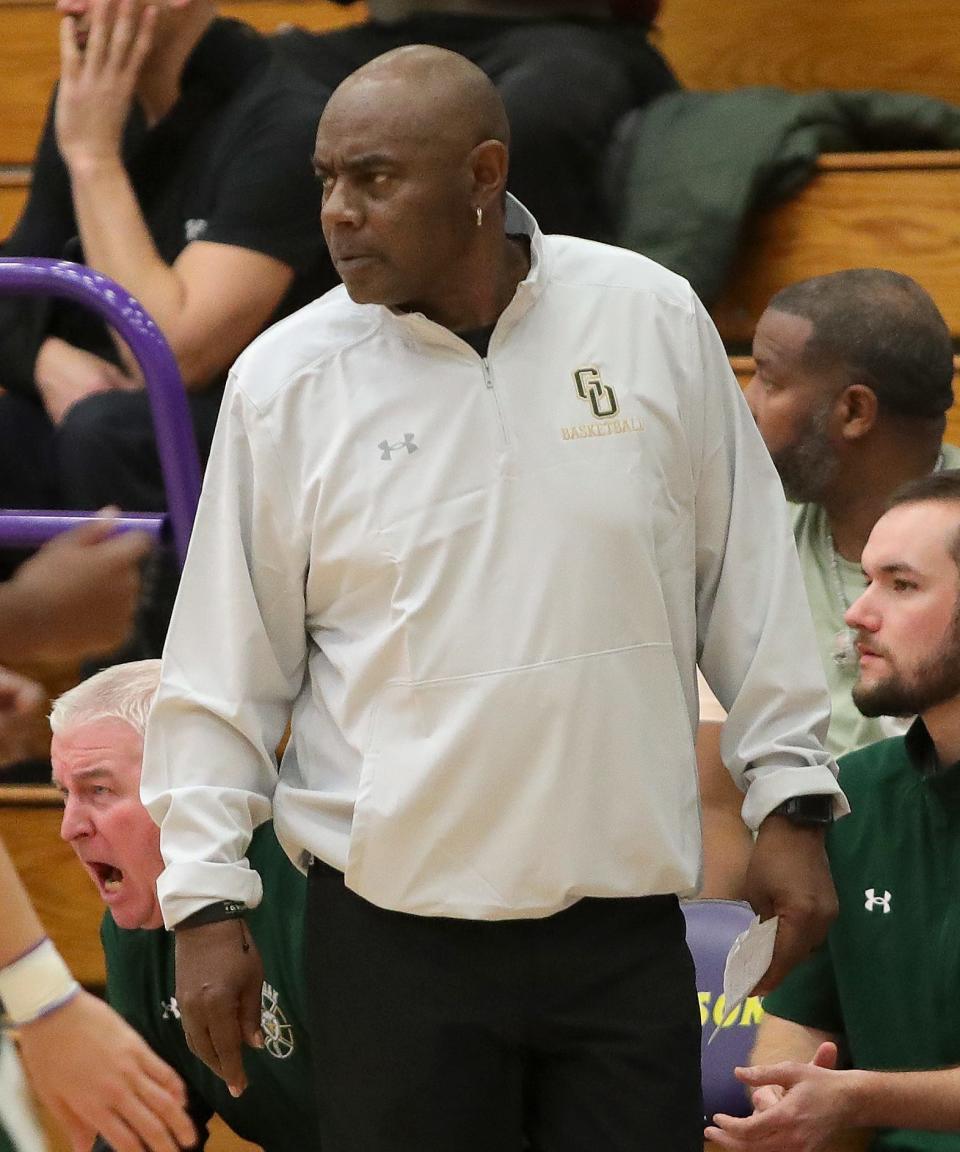 GlenOak boys basketball head coach Rick Hairston watches the action at Jackson High School, Friday, Dec. 22, 2023.