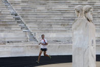 Jurgen Mennel from Germany runs inside the Panathenean stadium, where the first modern Olympics were held in 1896, in Athens, October 21, 2010. Greece's culture ministry has honored long distance runner Mennel, who has ran from Strasbourg to Athens in honour of the 2,500th Anniversary of the Battle of Marathon, with a ceremony at Greece's ancient Panathenean stadium. REUTERS/John Kolesidis