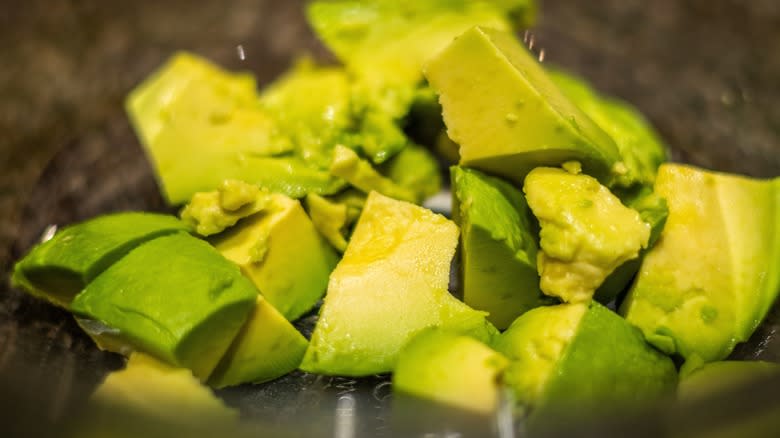 Avocado chunks in glass bowl