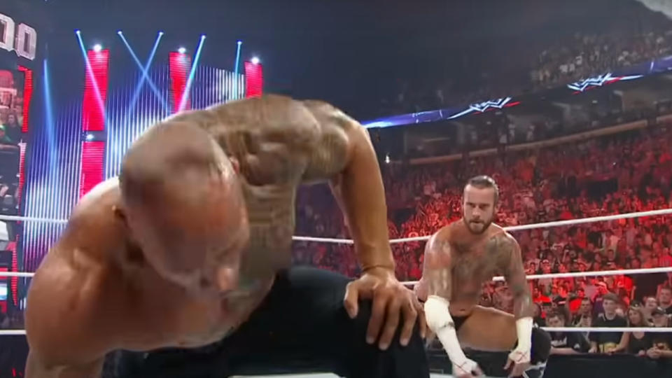 CM Punk preparing to attack The Rock at Raw 1000