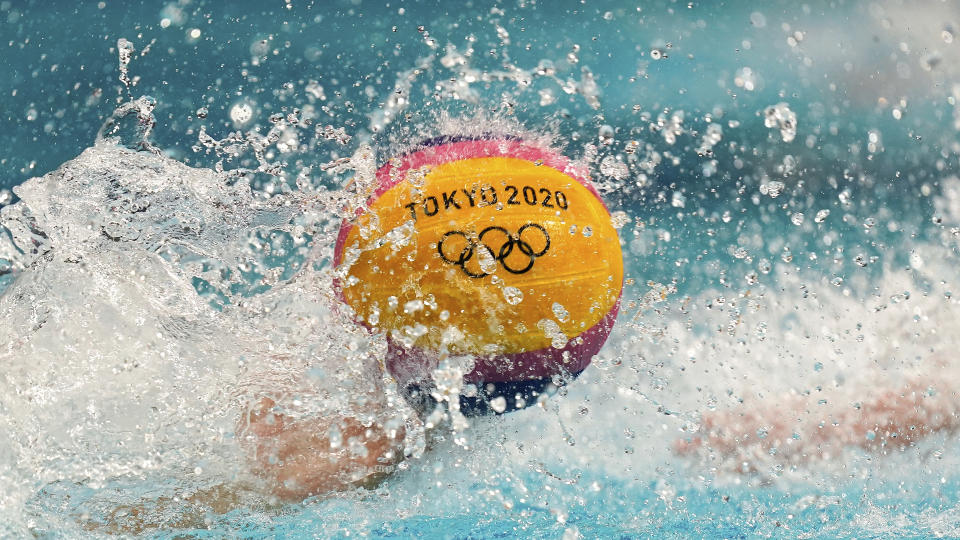 <p>Players reach for the ball at the start of the fourth quarter during a preliminary round men's water polo match between Italy and South Africa at the 2020 Summer Olympics, Sunday, July 25, 2021, in Tokyo, Japan. (AP Photo/Mark Humphrey)</p> 