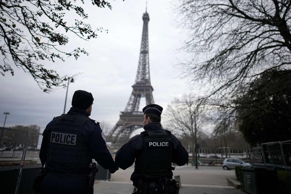 <p>AP Photo/Christophe Ena</p> One man was killed and another two were injured in a knife and hammer attack near the Eiffel Tower in Paris on Dec. 2, 2023.