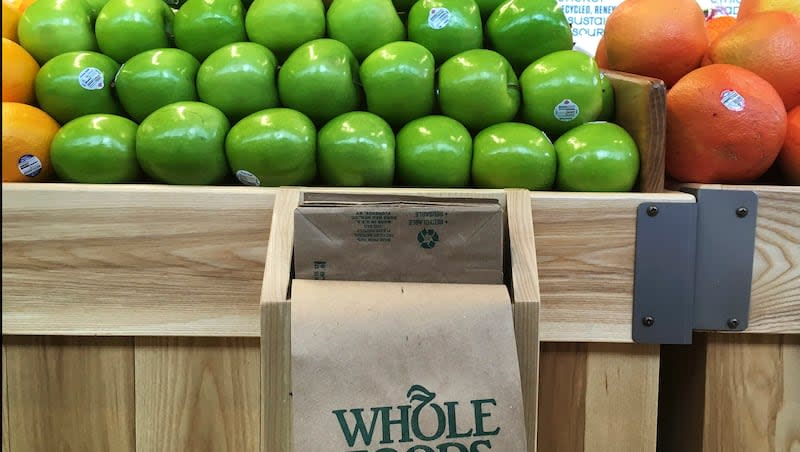 In this Saturday, July 15, 2017, photo, fruit is stacked in bins in the produce section of the Whole Foods Market in Sudbury, Mass. Superfoods may support older adults in healthy aging.