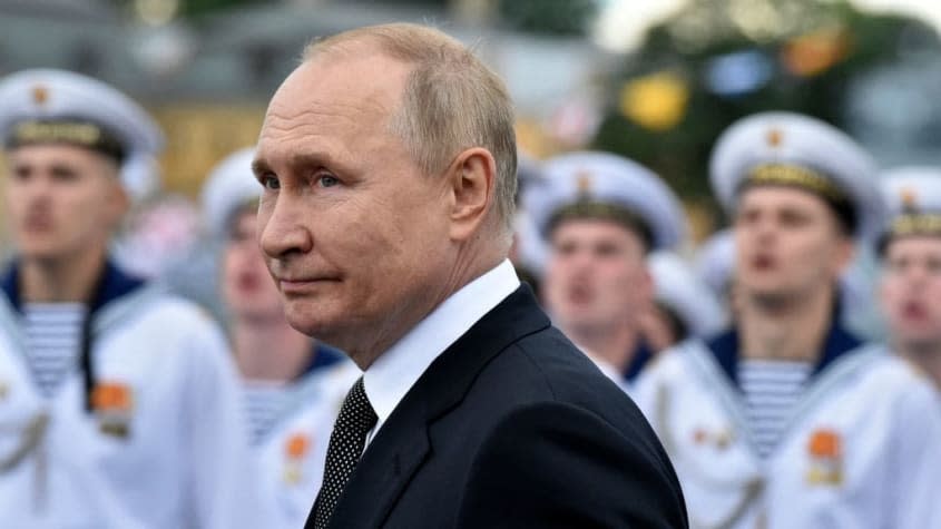 Russian President Vladimir Putin with members of Russia's navy.