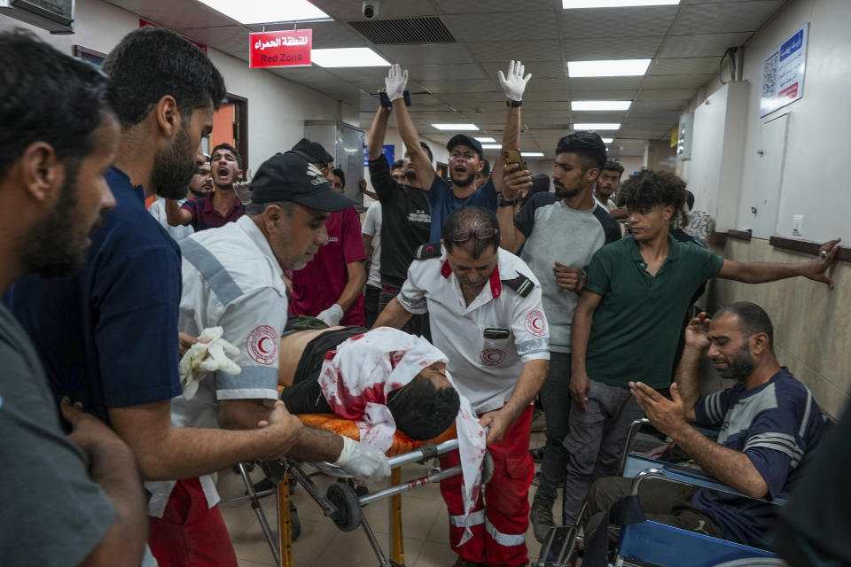 Palestinians wounded in the Israeli bombardment of the Gaza Strip are brought to Al Aqsa hospital in Deir al Balah, Gaza Strip, Tuesday, Thursday, May 23, 2024. (AP Photo/Abdel Kareem Hana)