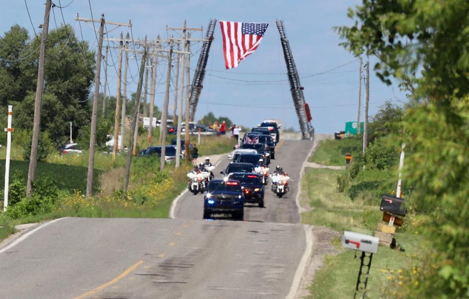 The funeral procession for U.S. Rep. Jackie 
Walorski travels on Elm Road Thursday, Aug. 11, 2022, to Southlawn Cemetery in South Bend.