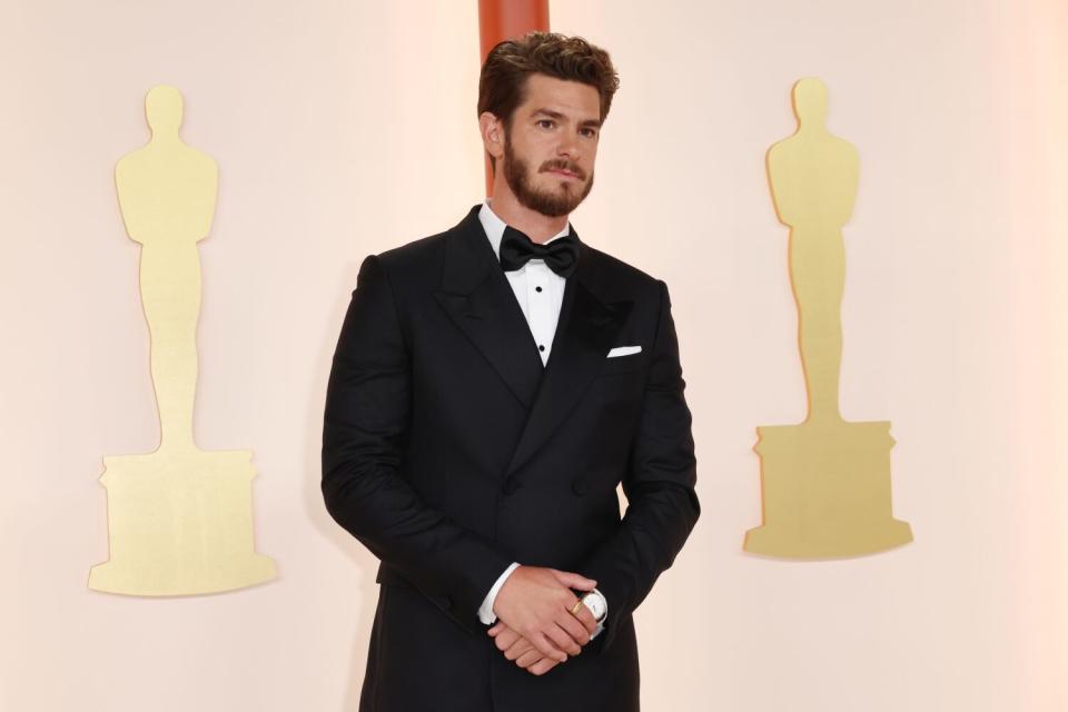 Andrew Garfield in a classic black tuxedo and bow tie, plus a perfectly aligned white pocket square.