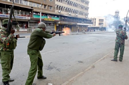 FILE PHOTO: Riot policemen fire tear gas to disperse supporters of Kenyan opposition National Super Alliance (NASA) coalition, during a protest along a street in Nairobi, Kenya, October 11, 2017. REUTERS/Thomas Mukoya