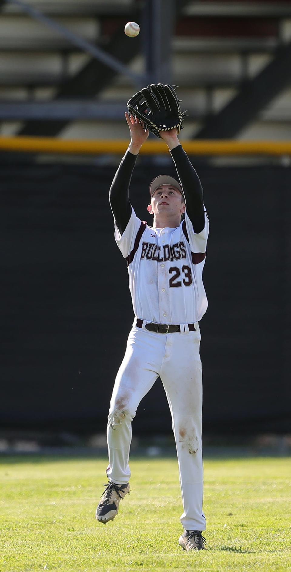 Woodridge centerfielder Steven Duffy gets under a fly ball hit by Coventry batter Johnny Clemente during the second inning of a baseball game on Monday.