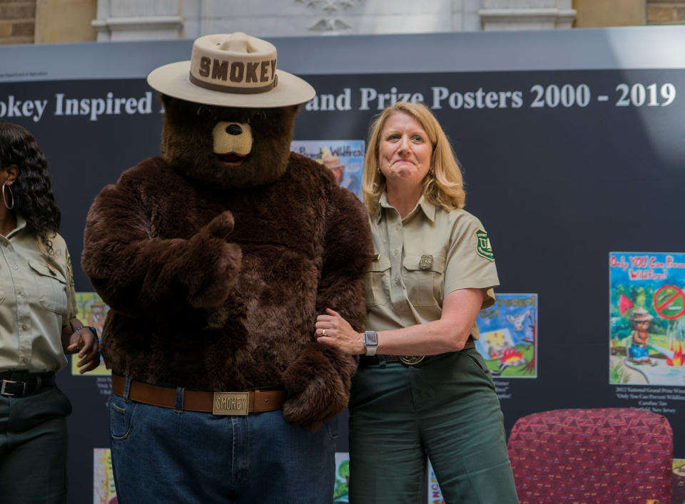 An officer of the Forest Service celebrates Smokey Bear's 75th birthday during a ceremony in Washington, D.C., in August. (Photo: Handout/Reuters)