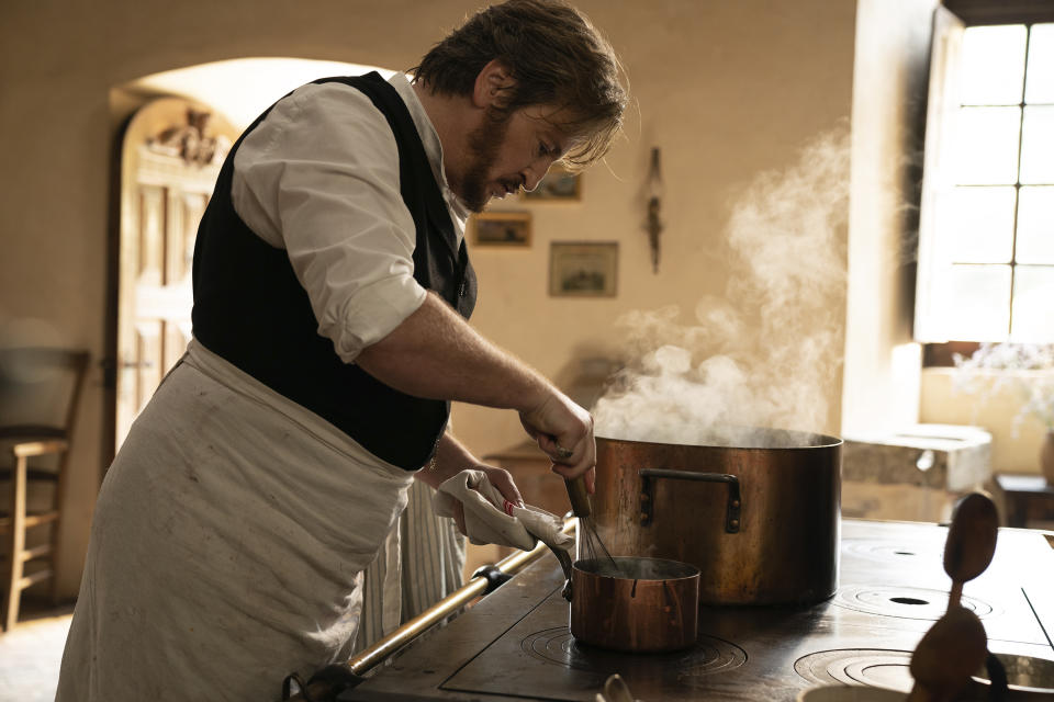 This image released by IFC Films shows Benoît Magimel in a scene from "The Taste of Things." (Stéphanie Branchu/IFC Films via AP)