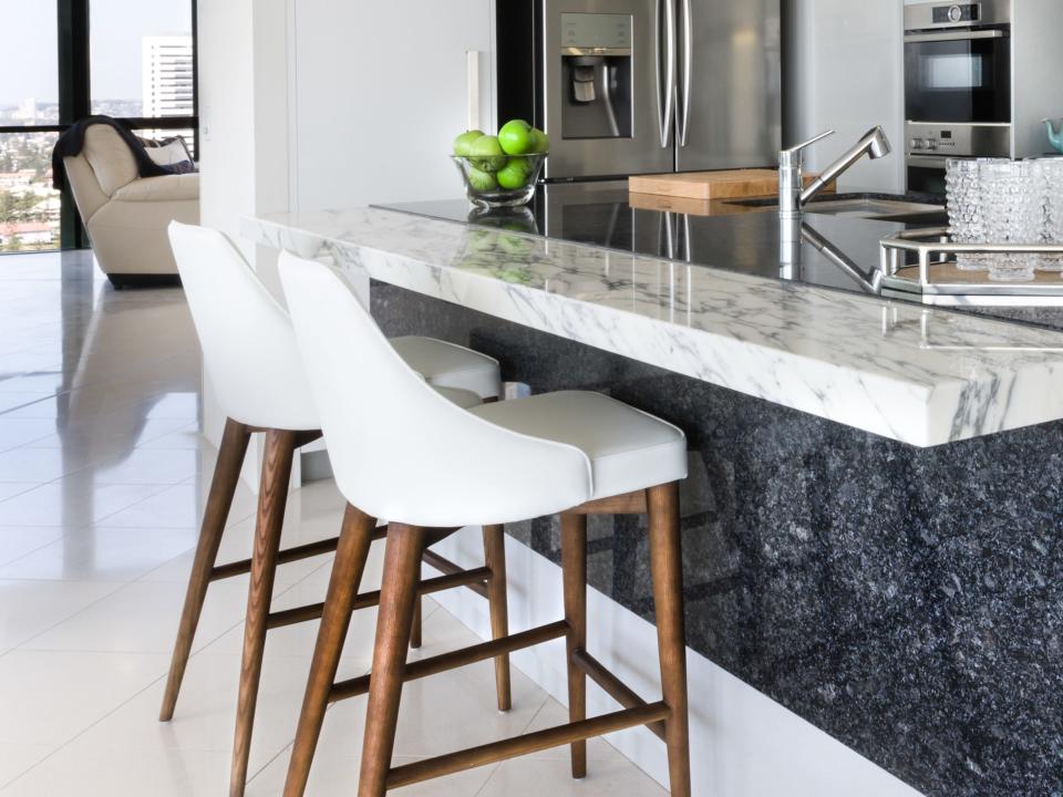 White kitchen stools at kitchen island