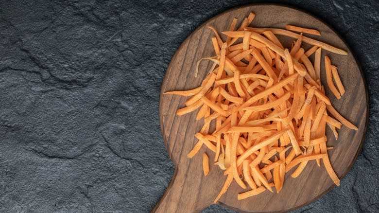 Julienne carrots on cutting board