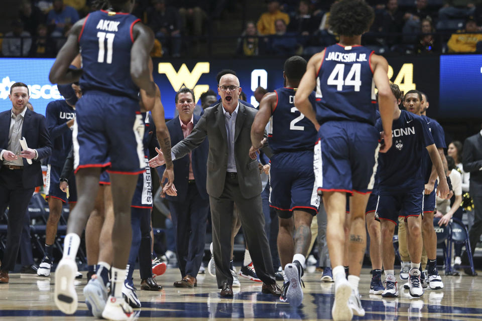 Connecticut coach Dan Hurley reacts during the first half of the team's NCAA college basketball game against West Virginia in Morgantown, W.Va., Wednesday, Dec. 8, 2021. (AP Photo/Kathleen Batten)