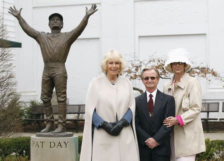 Camilla, Duchess of Cornwall (L) poses for a photo with Hall of Fame Jockey Pat Day (C) and his wife Sheila Day (R) at Churchill Downs, home of the Kentucky Derby horse race, during her visit in Louisville, Kentucky March 20, 2015. REUTERS/John Sommers II