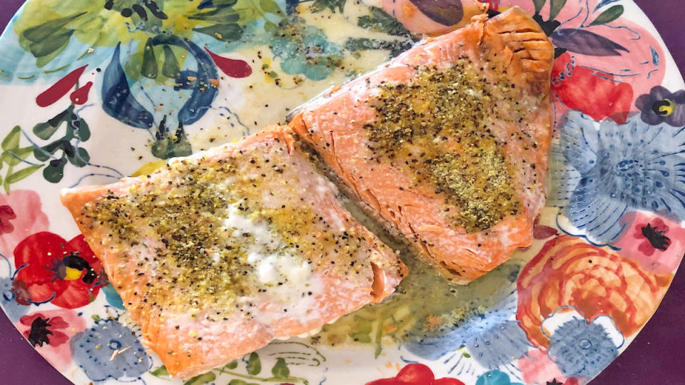 Microwave poached salmon served on a colorful plate