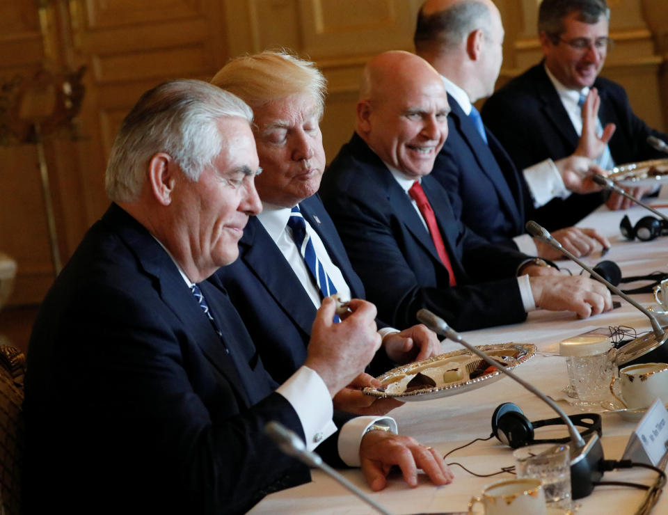 U.S. Secretary of State Rex Tillerson, Trump and national security adviser H.R. McMaster eat Belgian chocolate during their meeting with Belgian Prime Minister Charles Michel in Brussels, Belgium.