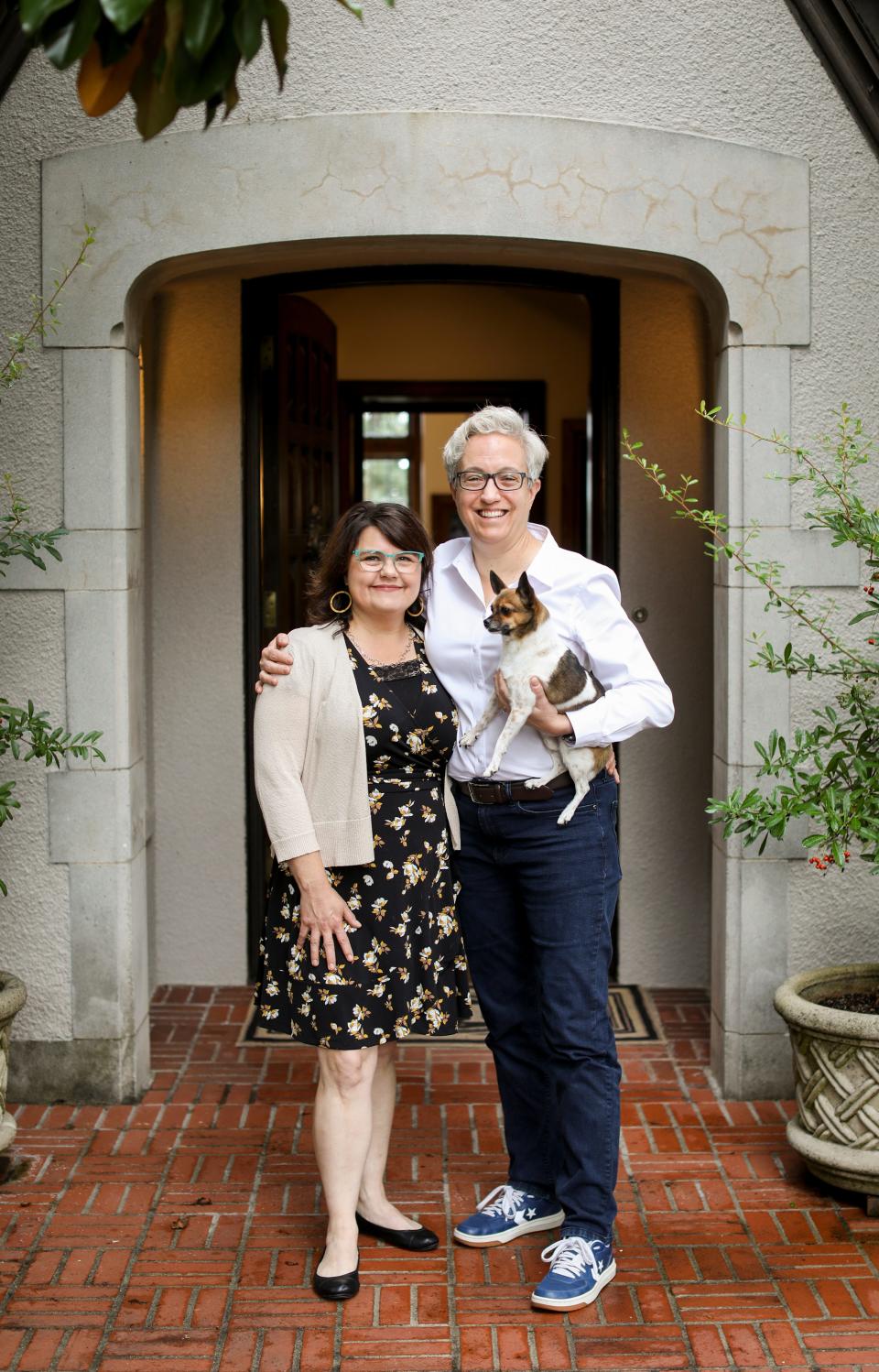 Gov. Tina Kotek with First Lady Aimee Kotek Wilson and their dog, Teddy, at Mahonia Hall in Salem. The Oregon governor's mansion was built in 1924 and deeded to the state in the late 1980s.