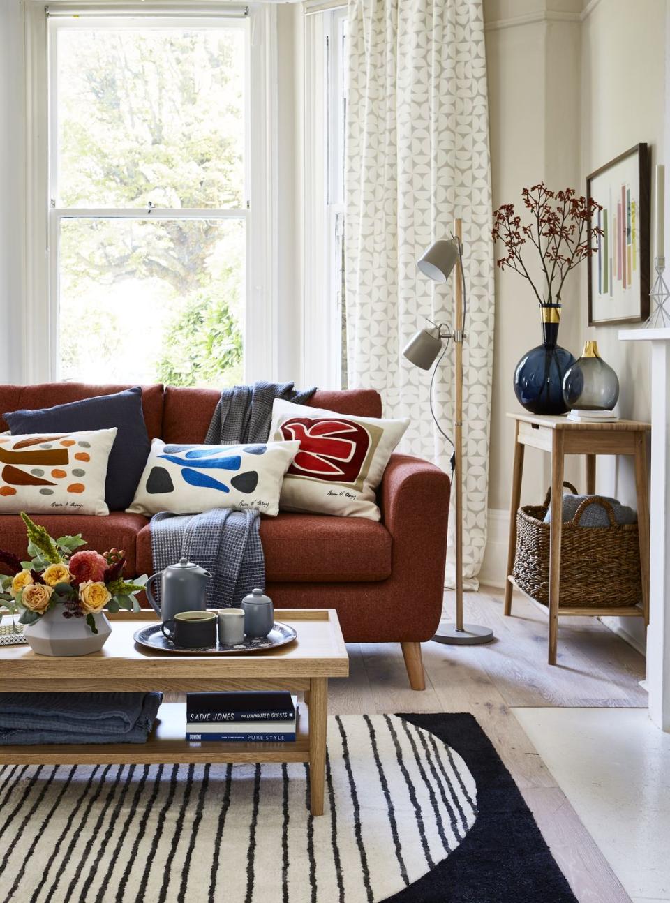 living room bold, bird print cushions and a block stripe rug provide eyecatching focal points in a scheme of elegantly streamlined, sleek furniture and pared back accessories add texture with wool throws and chunky ceramicswalls painted in skimming stone estate emulsion, £3950 for 25l, farrow  ball floor in oak linen from the artisan collection, £8880 a sq metre, kahrs needham sofa in munro burnt orange, £849 conran solar stripe rug, from £149 alto coffee table, £229 loft floor lamp, £99 conran colour chips wall art, £119 all marks  spencer aalto console table, £220, cox  cox curtains made up in siv natural, from the spira collection, £3450a metre, the swedish fabric company cushions on sofa l r conran breon o’casey orange bird, £25 bantry weave in dark blue, £12 conran breon o’casey blue bird, £25 conran breono’casey red bird, £2950 block striped throw, £59 all marks  spencer on coffee table grey hexagon ceramic pot, £26, holly’s house loft floral tray, £1950, marks  spencer murmur stoneware teapot, £26 murmur stoneware sugar bowl, £14 both bedeck charcoal mug, £27 grey espresso jug, £17 waffle linen throw, £145 all oggetto on console table conran round vase, £35 conran bubble vase, £4950 cosy retreat large vase seen on cover, £2950 all marks  spencer murmur banana storage basket in natural, £65, bedeck soft wool throw, £60, cox  coxl with thanks to marks  spencer