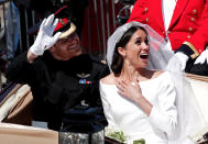 <p>The couple were greeted by rapturous applause as their carriage took them through Windsor. (Photo: Reuters) </p>